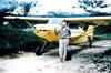 Missionary pilot Nate Saint with the original plane circa 1956